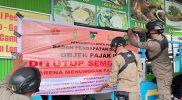 Pemkot Palu menyegel sejumlah warung penunggak pajak, Selasa (5/8/2025). (Foto: Pemkot Palu)